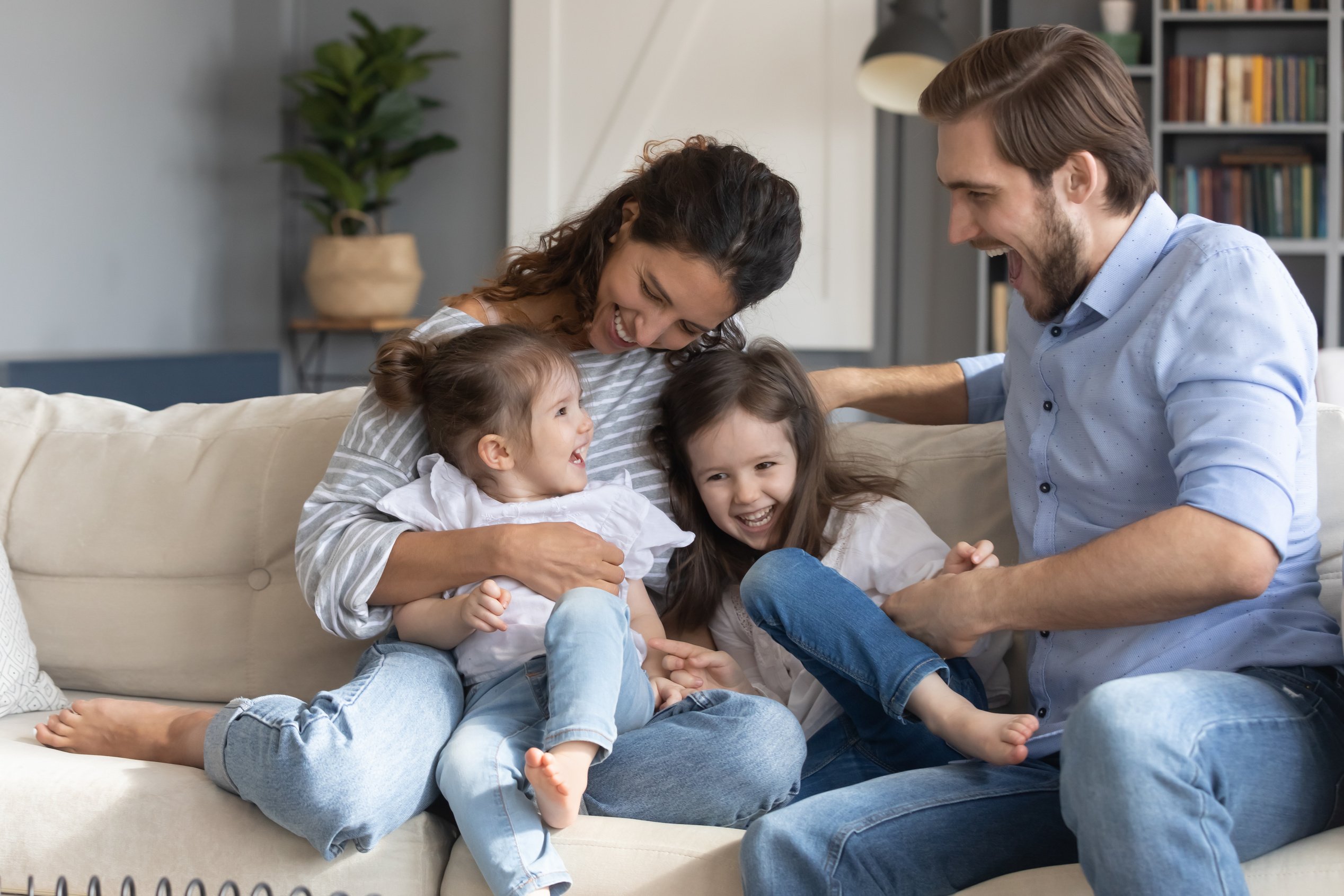 Overjoyed family with kids play at home